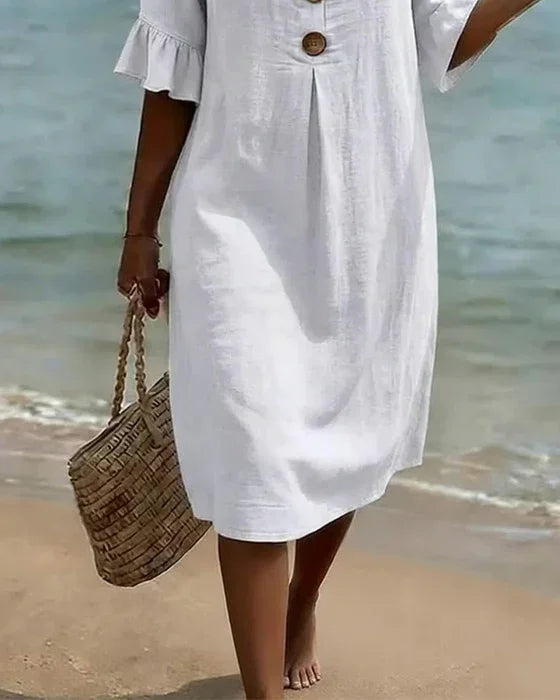 Linen dress with texture, puff sleeves, and buttons