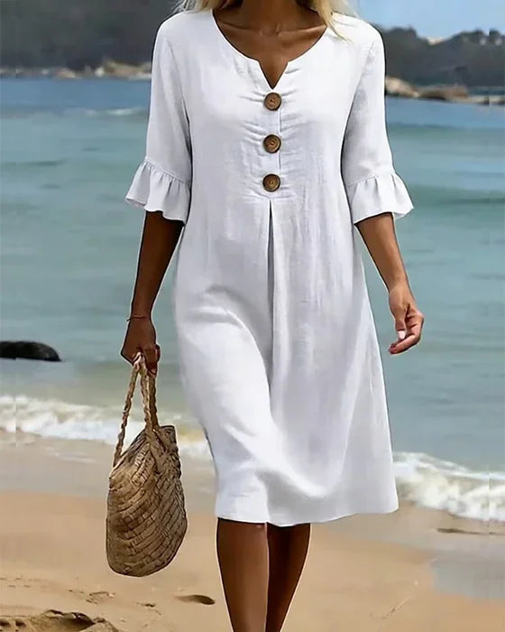 Linen dress with texture, puff sleeves, and buttons